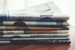 Stack of folded newspapers on a table